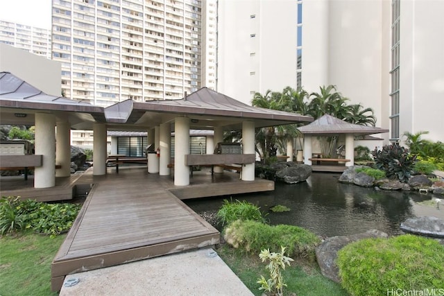 exterior space with a water view and a gazebo