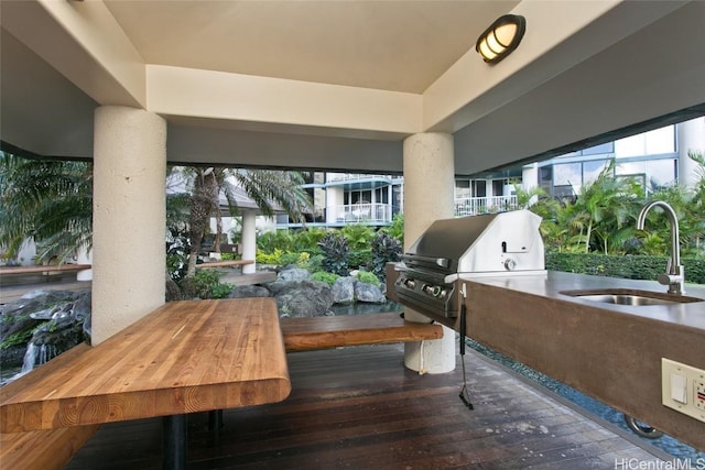 view of patio with sink, exterior kitchen, and grilling area