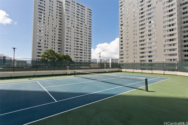 view of tennis court featuring basketball court