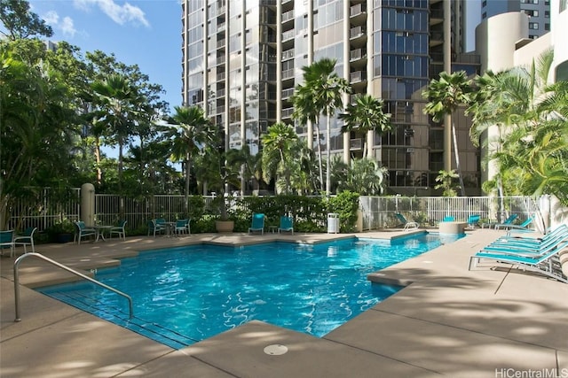 view of swimming pool with a patio