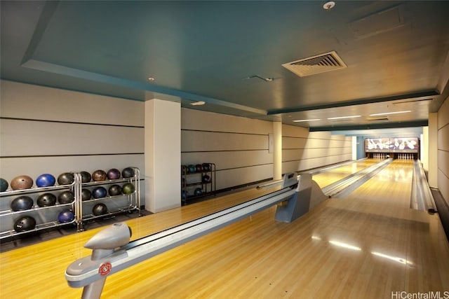 playroom with a bowling alley and hardwood / wood-style flooring