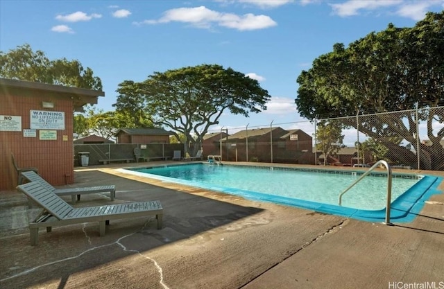 pool featuring a patio and fence