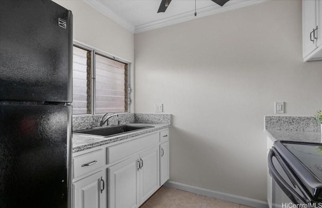 kitchen with light tile patterned floors, ornamental molding, black appliances, white cabinetry, and a sink