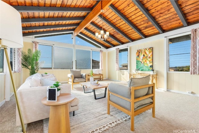 carpeted living room featuring vaulted ceiling with beams, a chandelier, and wood ceiling