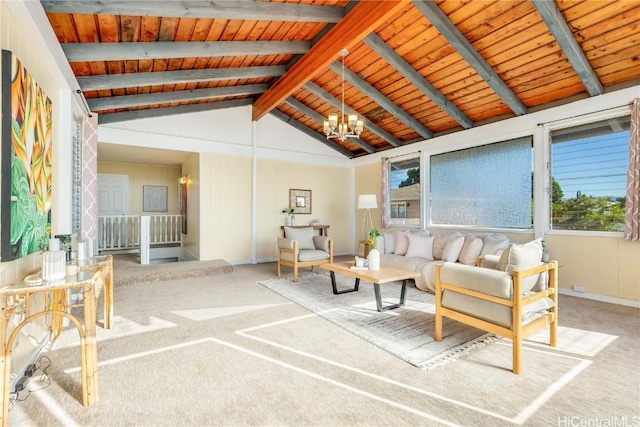 carpeted living room with a notable chandelier, lofted ceiling with beams, and wooden ceiling