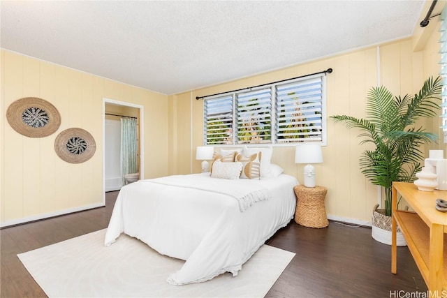 bedroom featuring dark hardwood / wood-style floors