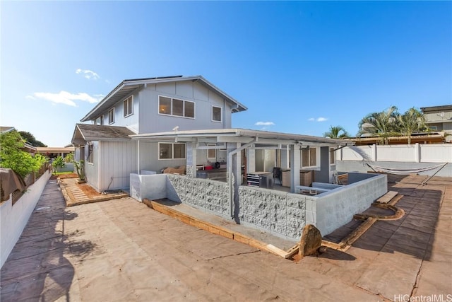 rear view of house with a patio