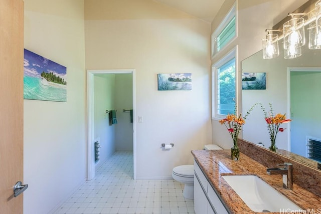 bathroom featuring toilet and vanity