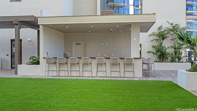 view of patio featuring an outdoor bar