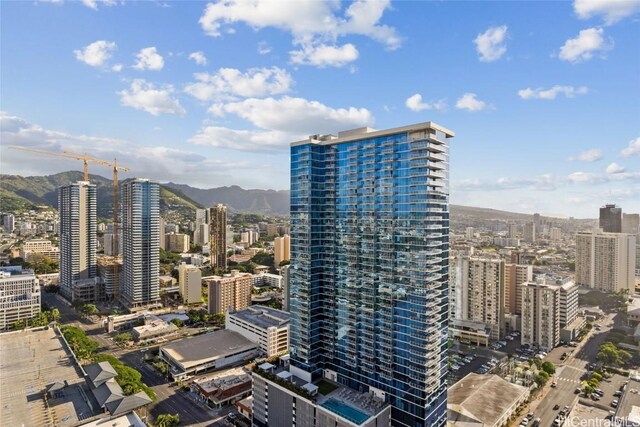 property's view of city with a mountain view