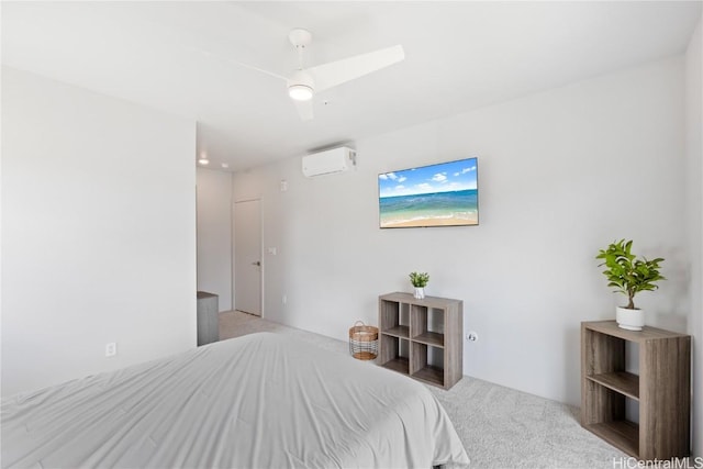 bedroom with ceiling fan, light colored carpet, and a wall unit AC