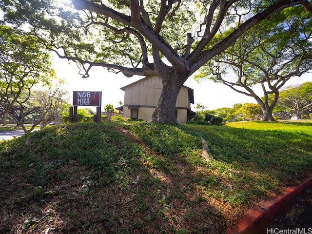 view of side of home featuring a lawn