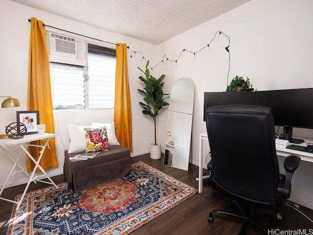 office area with a textured ceiling and dark hardwood / wood-style floors