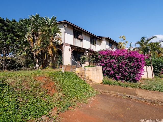 view of front of home featuring cooling unit