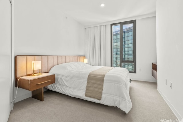 carpeted bedroom with multiple windows