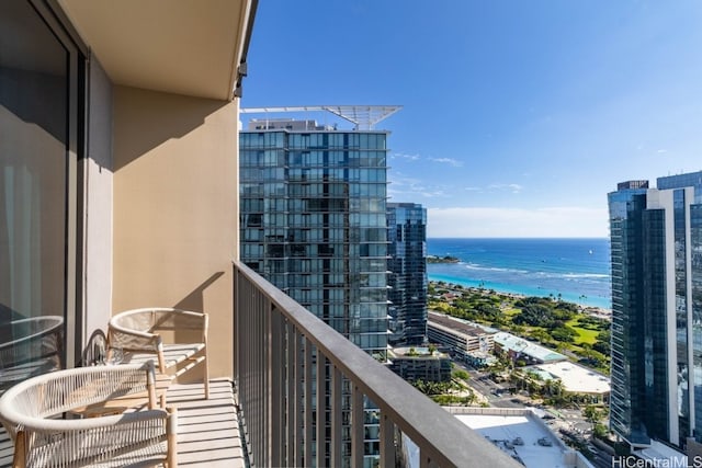 balcony featuring a water view