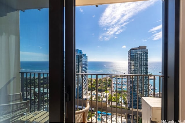 balcony featuring a water view