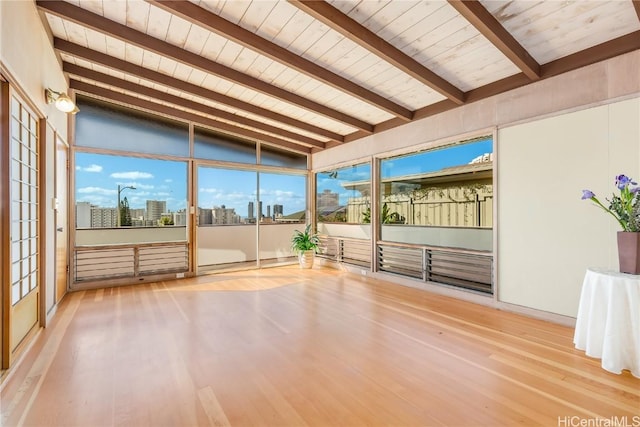 unfurnished sunroom with lofted ceiling with beams and wooden ceiling