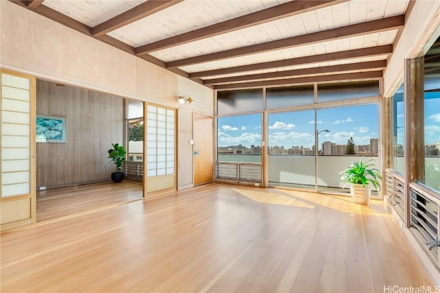 interior space featuring wooden ceiling and vaulted ceiling with beams