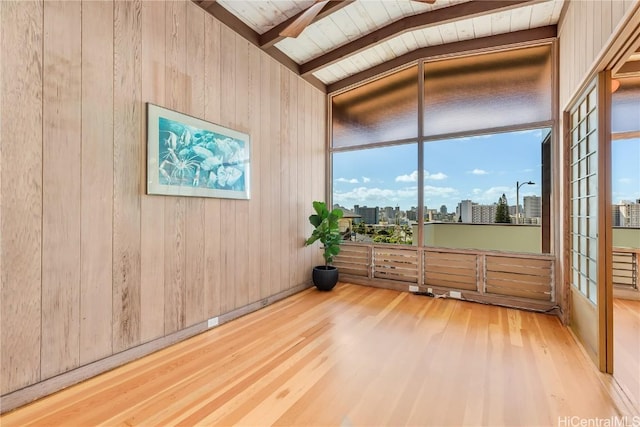 interior space with vaulted ceiling with beams and wooden ceiling