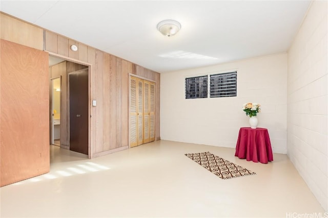 interior space featuring wood walls