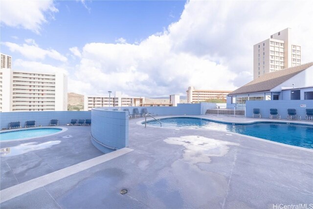 view of swimming pool featuring a patio area