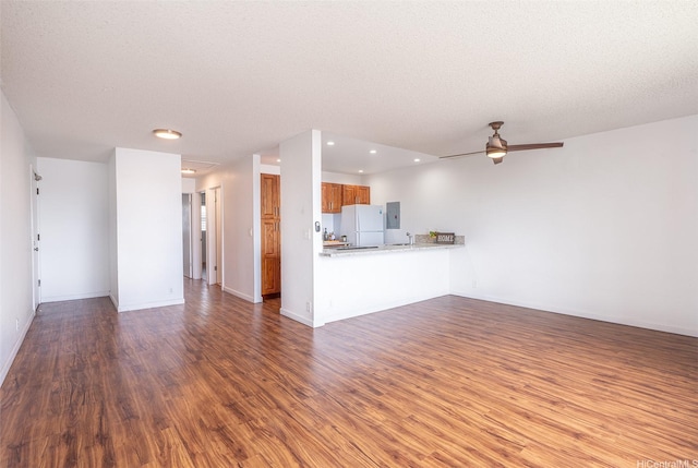 46-263 Kahuhipa St Unit B312, Kaneohe, HI 96744 - unfurnished living room featuring wood finished floors, a ceiling fan, recessed lighting, baseboards, and electric panel