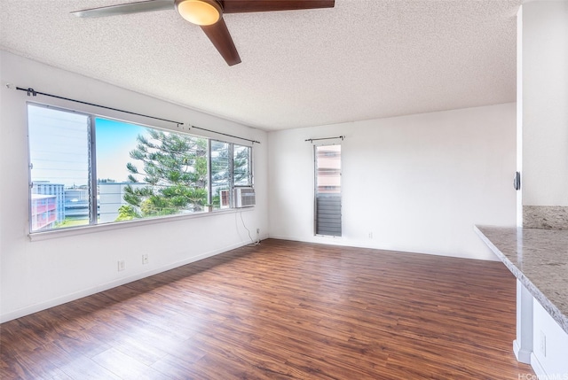 46-263 Kahuhipa St Unit B312, Kaneohe, HI 96744 - unfurnished room with a textured ceiling, wood finished floors, ceiling fan, and cooling unit