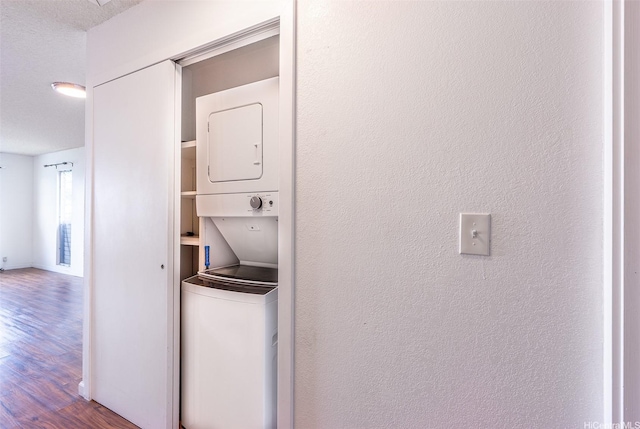 46-263 Kahuhipa St Unit B312, Kaneohe, HI 96744 - laundry area with stacked washer / drying machine and wood finished floors