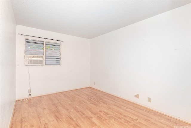 46-263 Kahuhipa St Unit B312, Kaneohe, HI 96744 - empty room featuring wood finished floors, cooling unit, and baseboards
