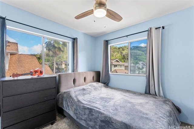 carpeted bedroom with ceiling fan