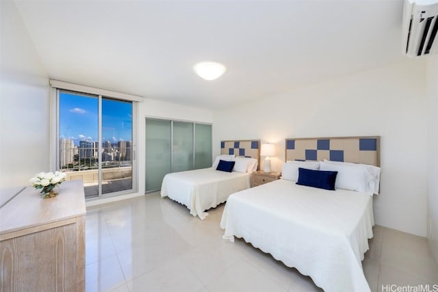 bedroom featuring light tile patterned floors, a wall of windows, access to outside, and a wall mounted air conditioner