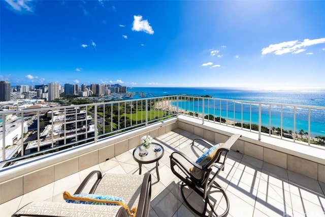 balcony featuring a water view