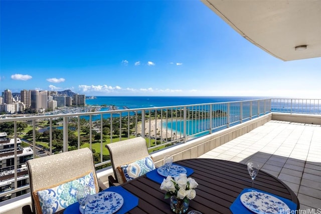 balcony featuring a water view