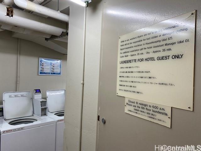 clothes washing area featuring separate washer and dryer