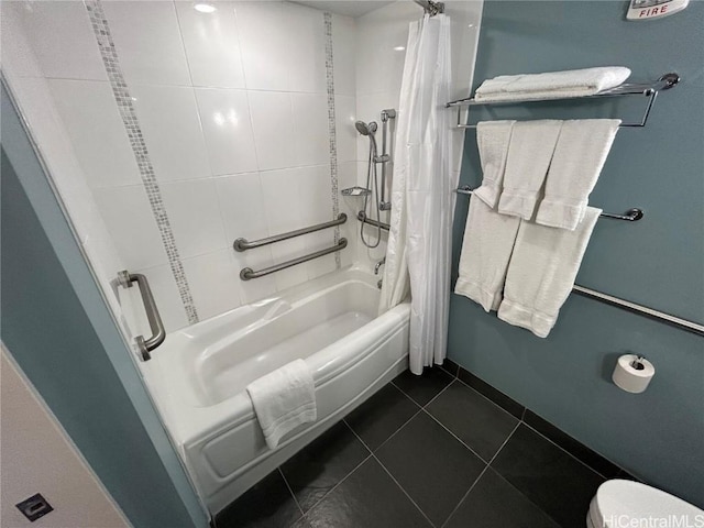 bathroom featuring shower / tub combo with curtain, toilet, and tile patterned floors