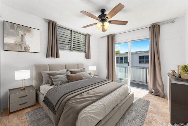 carpeted bedroom featuring ceiling fan and access to exterior