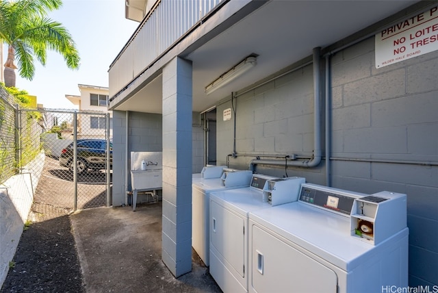 laundry room featuring separate washer and dryer and sink