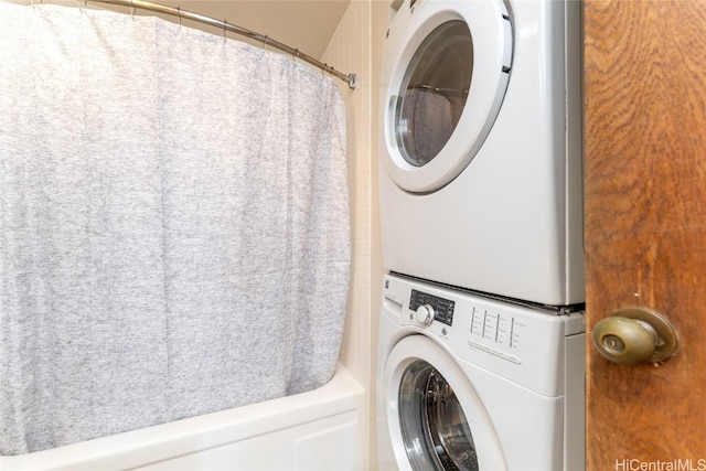 laundry room featuring stacked washing maching and dryer