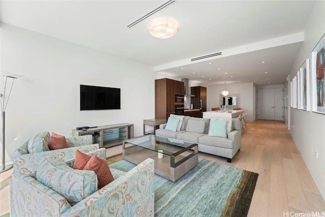 living room with light hardwood / wood-style floors