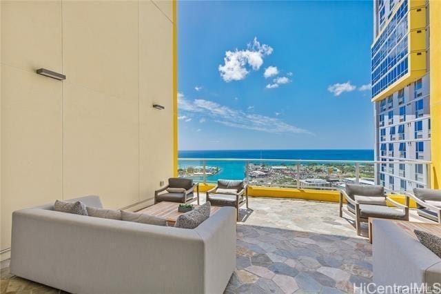 view of patio / terrace with a water view and an outdoor hangout area