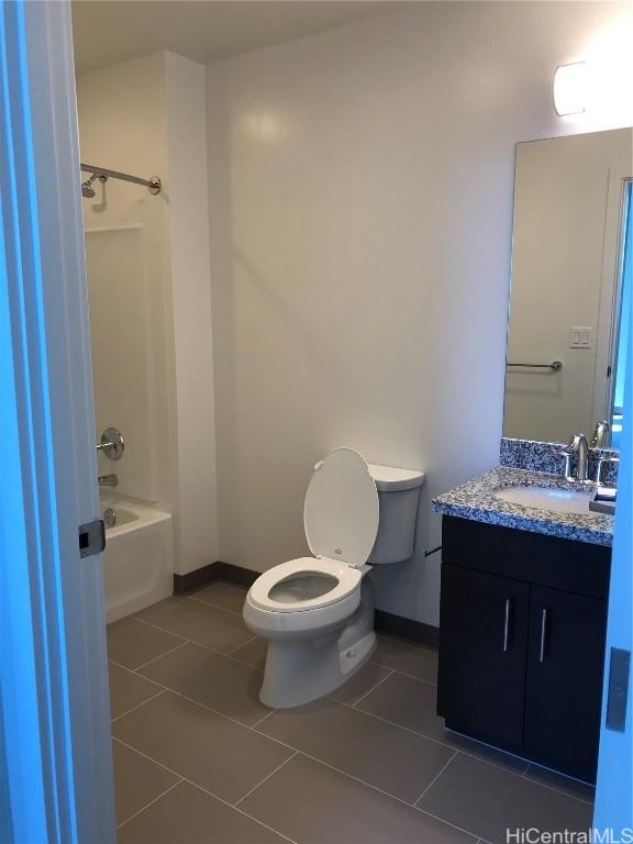 full bathroom with shower / bath combination, toilet, vanity, and tile patterned flooring