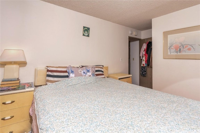 bedroom featuring a textured ceiling