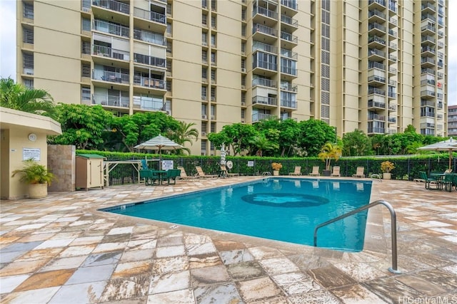 view of swimming pool with a patio