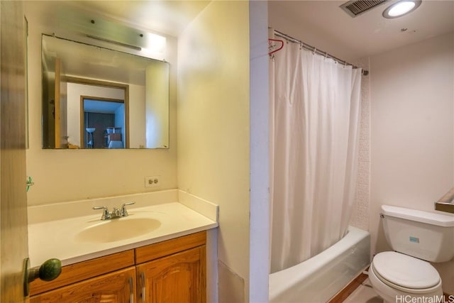 full bathroom with toilet, shower / bath combo with shower curtain, and vanity