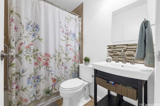 full bathroom with toilet, vanity, shower / bath combination with curtain, and tasteful backsplash