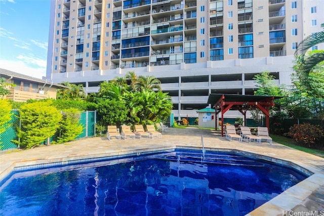 view of pool with a patio area and a gazebo