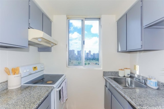 kitchen featuring sink, white electric range, and plenty of natural light