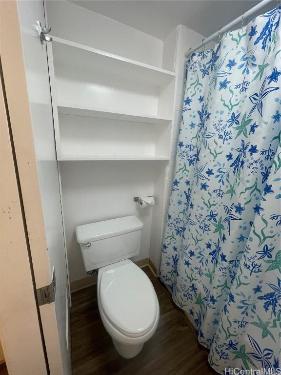 bathroom featuring toilet and hardwood / wood-style floors