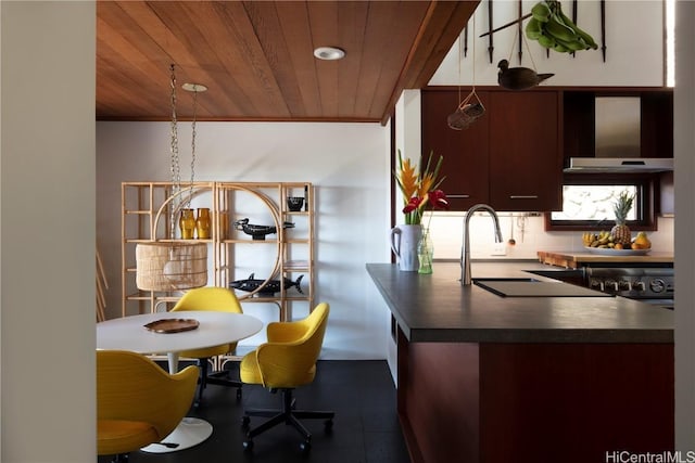 kitchen featuring wood ceiling, wall chimney exhaust hood, range, and backsplash